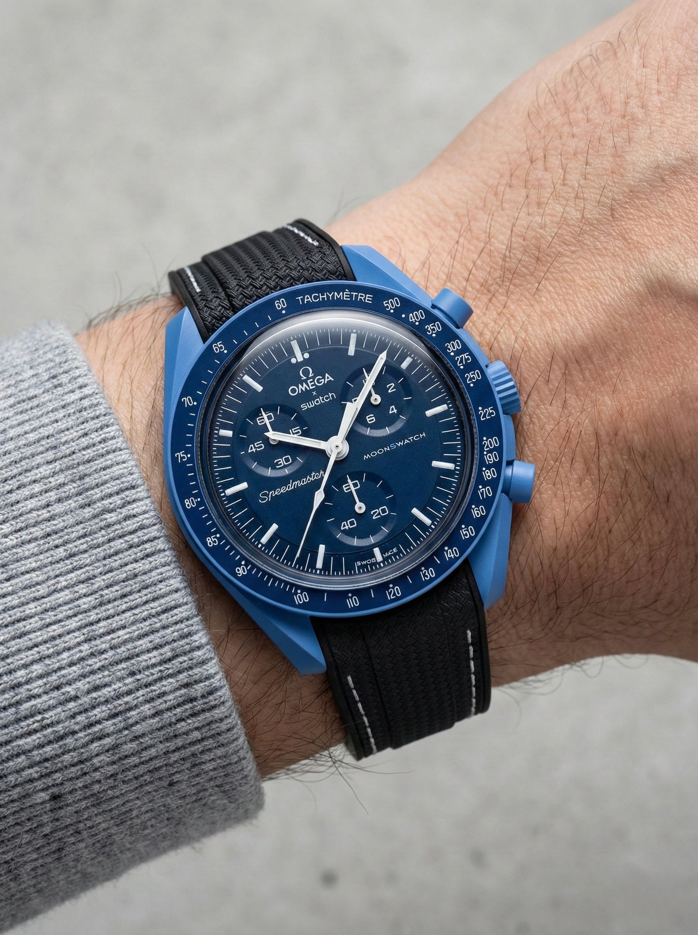 Black stitch rubber strap for Omega x Swatch MoonSwatch Mission to Neptune. 